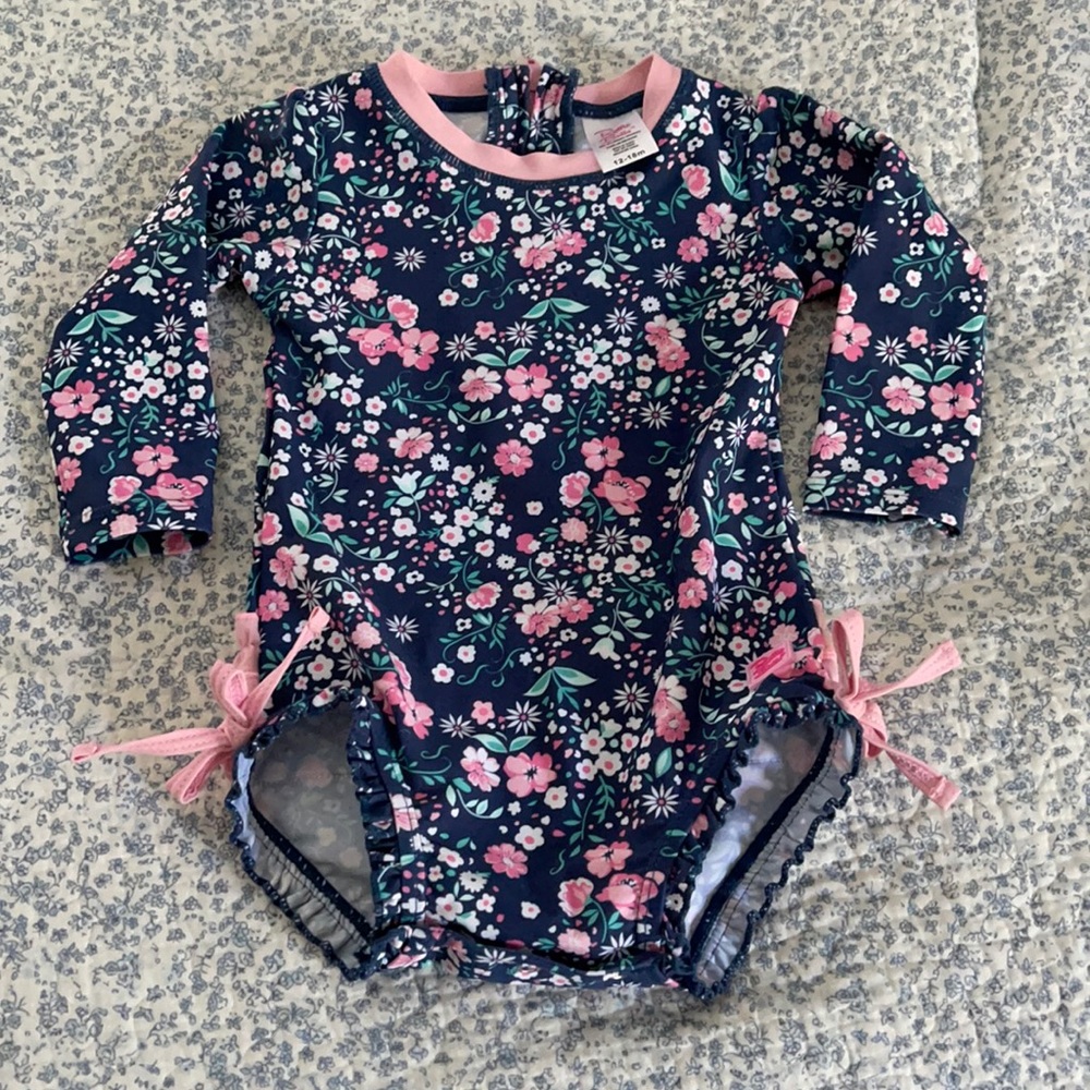 NWOT Ruffle Butts long sleeve swim suit.